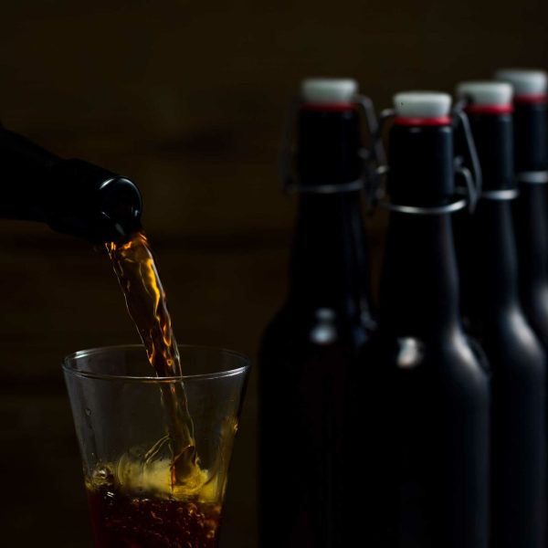 Beer glases on the background of wooden boards studio light